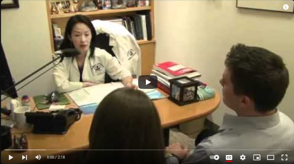 A young couple consult with their doctor about fertility